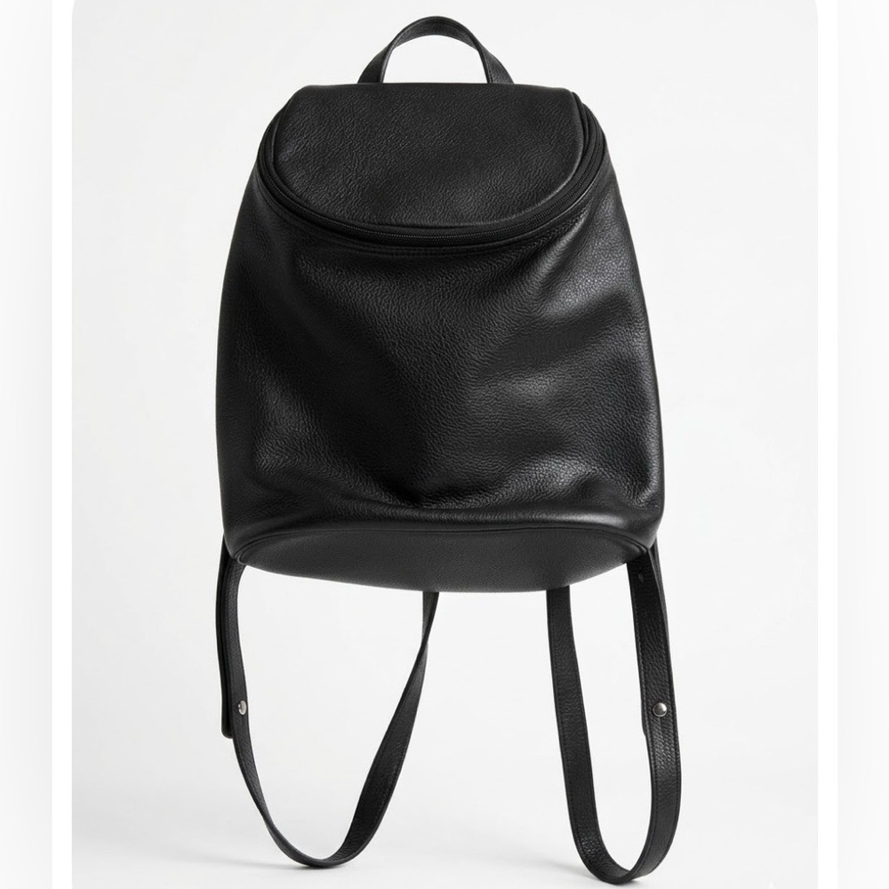 Vintage Longchamp black pebbled leather backpack medium size silver hardwear